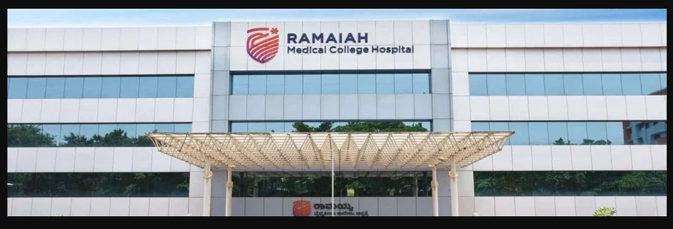 Ramaiah Medical College Hospital building front view with glass windows and covered entrance canopy.